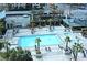 Aerial view of a sparkling swimming pool with palm trees and comfortable lounge chairs at 125 E Harmon Ave # 1918, Las Vegas, NV 89109