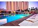 Luxury swimming pool features comfortable lounge chairs and city views in a resort setting at 125 E Harmon Ave # 1918, Las Vegas, NV 89109