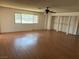 A bedroom featuring laminate floors, a ceiling fan, and natural light at 1674 Seneca Ln, Las Vegas, NV 89169