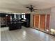 Spacious kitchen with dark cabinets, tile countertops, and a central island at 1674 Seneca Ln, Las Vegas, NV 89169