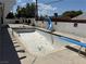 An empty swimming pool with a slide and diving board at 1674 Seneca Ln, Las Vegas, NV 89169