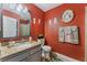Bathroom features granite countertops, a framed mirror, and decorative wall hangings at 1812 N Decatur Blvd # 103, Las Vegas, NV 89108