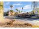 Desert community featuring covered parking, multi-story buildings, mature palm trees, and blue skies at 1812 N Decatur Blvd # 103, Las Vegas, NV 89108