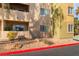 Charming exterior of a multi-story building with private balconies and well-maintained landscaping at 1812 N Decatur Blvd # 103, Las Vegas, NV 89108