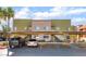 Building exterior with covered parking, well-maintained landscaping, and convenient stair access to upper levels at 1812 N Decatur Blvd # 103, Las Vegas, NV 89108
