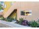 Charming entry with stairs, lush plants, and easy access to unit, perfect for a warm welcome at 1812 N Decatur Blvd # 103, Las Vegas, NV 89108