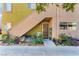 Inviting entrance with lush plants, stairs, and convenient access to the upper unit at 1812 N Decatur Blvd # 103, Las Vegas, NV 89108