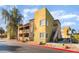 Multi-story building featuring private balconies, complemented by well-kept landscaping and nearby parking at 1812 N Decatur Blvd # 103, Las Vegas, NV 89108