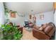 Cozy living room features leather seating, tile floors, and charming decor at 1812 N Decatur Blvd # 103, Las Vegas, NV 89108