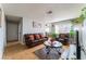 Cozy living area with tile flooring, leather seating, and an open view to the adjacent dining space at 1812 N Decatur Blvd # 103, Las Vegas, NV 89108