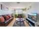 Comfortable living room with plush leather seating, warm lighting, and modern entertainment setup at 1812 N Decatur Blvd # 103, Las Vegas, NV 89108