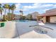 Community swimming pool and hot tub area surrounded by multi-story condos and palm trees at 1812 N Decatur Blvd # 103, Las Vegas, NV 89108