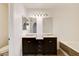 Bathroom with double sinks, decorative lighting, and a soaking tub at 1846 N Decatur Blvd # 104, Las Vegas, NV 89108
