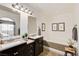 Elegant bathroom with dual sinks, a soaking tub, and modern fixtures at 1846 N Decatur Blvd # 104, Las Vegas, NV 89108