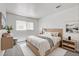 Cozy bedroom featuring natural light, stylish decor, and a comfortable bed at 1846 N Decatur Blvd # 104, Las Vegas, NV 89108