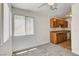 Living area with carpet and view of kitchen, providing a layout ideal for entertaining and dining at 1846 N Decatur Blvd # 104, Las Vegas, NV 89108