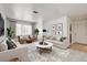 Bright living room features contemporary decor, plush seating, and large windows for natural light at 1846 N Decatur Blvd # 104, Las Vegas, NV 89108
