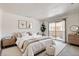 Serene main bedroom with balcony access and minimalist decor at 1846 N Decatur Blvd # 104, Las Vegas, NV 89108