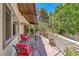 Back patio with red cushioned chairs offers an inviting space for relaxation and outdoor enjoyment at 2101 Plaza Del Fuentes, Las Vegas, NV 89102