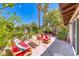 A relaxing backyard patio features outdoor seating and mature landscaping for outdoor enjoyment at 2101 Plaza Del Fuentes, Las Vegas, NV 89102