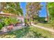 Relax on this backyard patio with chairs and mature landscaping at 2101 Plaza Del Fuentes, Las Vegas, NV 89102