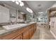 The primary bathroom offers dual sinks, a granite countertop, and an oversized soaking tub at 2101 Plaza Del Fuentes, Las Vegas, NV 89102