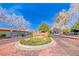 Spanish Oaks community entrance with manicured landscaping and clear blue skies at 2101 Plaza Del Fuentes, Las Vegas, NV 89102