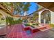 Charming courtyard featuring red tiled flooring, a central fountain, and arched walkways evoking a peaceful and inviting atmosphere at 2101 Plaza Del Fuentes, Las Vegas, NV 89102