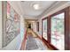 Well-lit hallway with beautiful artwork, wood floors and decorative rugs at 2101 Plaza Del Fuentes, Las Vegas, NV 89102