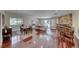 Expansive living room featuring hardwood floors, stone fireplace, and abundant natural light at 2101 Plaza Del Fuentes, Las Vegas, NV 89102