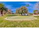 Scenic putting green nestled among mature trees, providing a relaxing space for golf enthusiasts to practice their skills at 2101 Plaza Del Fuentes, Las Vegas, NV 89102