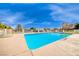 Refreshing swimming pool with clear blue water, surrounded by ample deck space and lush landscaping, perfect for summertime enjoyment at 2101 Plaza Del Fuentes, Las Vegas, NV 89102