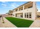 Spacious backyard featuring low-maintenance landscaping and a modern two-story home, perfect for outdoor living at 230 Cactus Sunrise St, Las Vegas, NV 89138