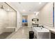 Bright bathroom with a soaking tub, walk in shower, dual sink vanity, and tile floors at 230 Cactus Sunrise St, Las Vegas, NV 89138