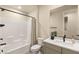 Contemporary bathroom with a white vanity, matte black faucet, and shower/tub combo with light gray accents at 230 Cactus Sunrise St, Las Vegas, NV 89138