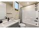 Modern bathroom featuring a shower-tub combo with a sleek gray vanity and stylish fixtures at 230 Cactus Sunrise St, Las Vegas, NV 89138