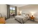 Cozy bedroom with a large window, desk, and a comfortable bed at 230 Cactus Sunrise St, Las Vegas, NV 89138