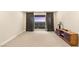 Spacious bonus room with balcony access, carpet flooring, and neutral color scheme at 230 Cactus Sunrise St, Las Vegas, NV 89138