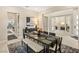 Open-concept dining area with modern table set, flowing seamlessly into other living spaces at 230 Cactus Sunrise St, Las Vegas, NV 89138