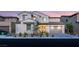 Charming two-story home boasting a tiled roof, neutral stucco, manicured landscaping, and a two car garage at 230 Cactus Sunrise St, Las Vegas, NV 89138