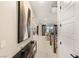 Inviting hallway leading to an open-concept living area with stairs and stylish décor at 230 Cactus Sunrise St, Las Vegas, NV 89138
