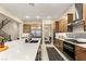 Well-lit kitchen with white countertops, a stainless steel fridge, and modern appliances at 230 Cactus Sunrise St, Las Vegas, NV 89138