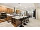 Stylish kitchen with a large island, stainless steel appliances, and bar seating at 230 Cactus Sunrise St, Las Vegas, NV 89138