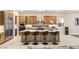 Modern kitchen with stainless steel appliances and a large center island with bar seating at 230 Cactus Sunrise St, Las Vegas, NV 89138