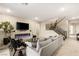 Open-concept living area with a modern fireplace and staircase at 230 Cactus Sunrise St, Las Vegas, NV 89138