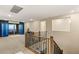 Upstairs loft area with access to a balcony, carpet flooring, and neutral walls at 230 Cactus Sunrise St, Las Vegas, NV 89138