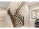 Elegant staircase with wooden handrails and carpeted steps leading to the upper level at 230 Cactus Sunrise St, Las Vegas, NV 89138