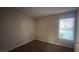 Cozy bedroom with window, door, and neutral walls at 2300 E Silverado Ranch Blvd # 1104, Las Vegas, NV 89183