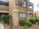 The exterior of the building is stucco with terra cotta accents, landscaping and unit numbers visible at 2300 E Silverado Ranch Blvd # 1104, Las Vegas, NV 89183