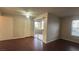 The living room boasts wood floors, a ceiling fan, sliding glass doors to a patio, and a bright window at 2300 E Silverado Ranch Blvd # 1104, Las Vegas, NV 89183